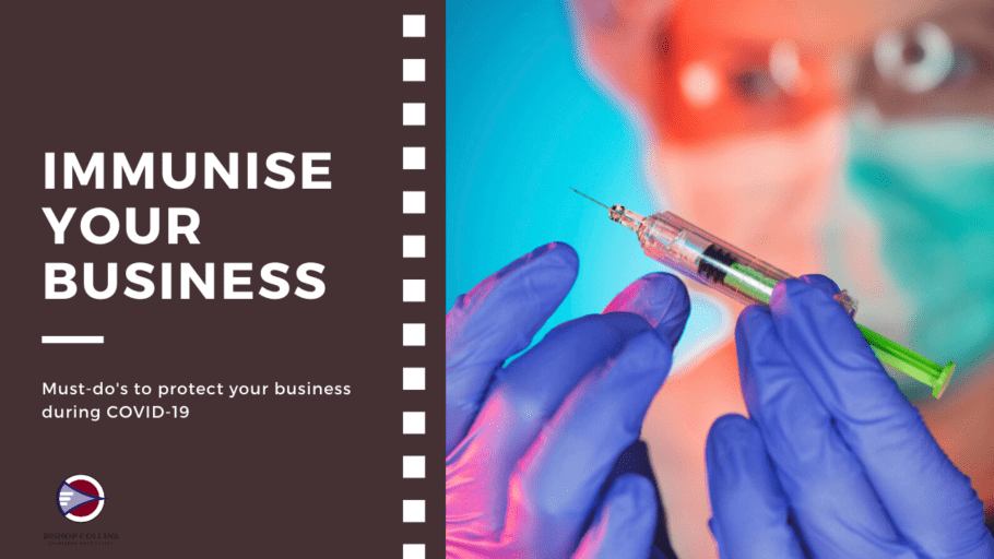 immunise your business needle being held by hands with purple cloves on. background of dr blurred