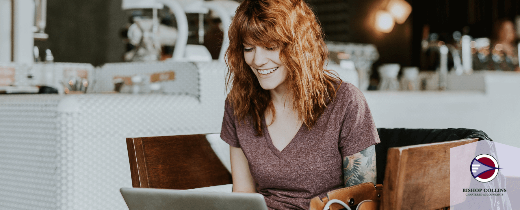 happy woman checking laptop