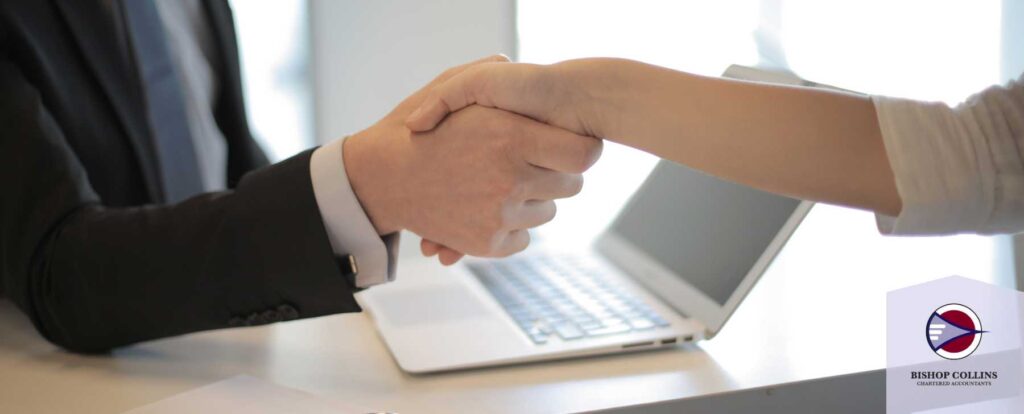 employer shaking hand of employee